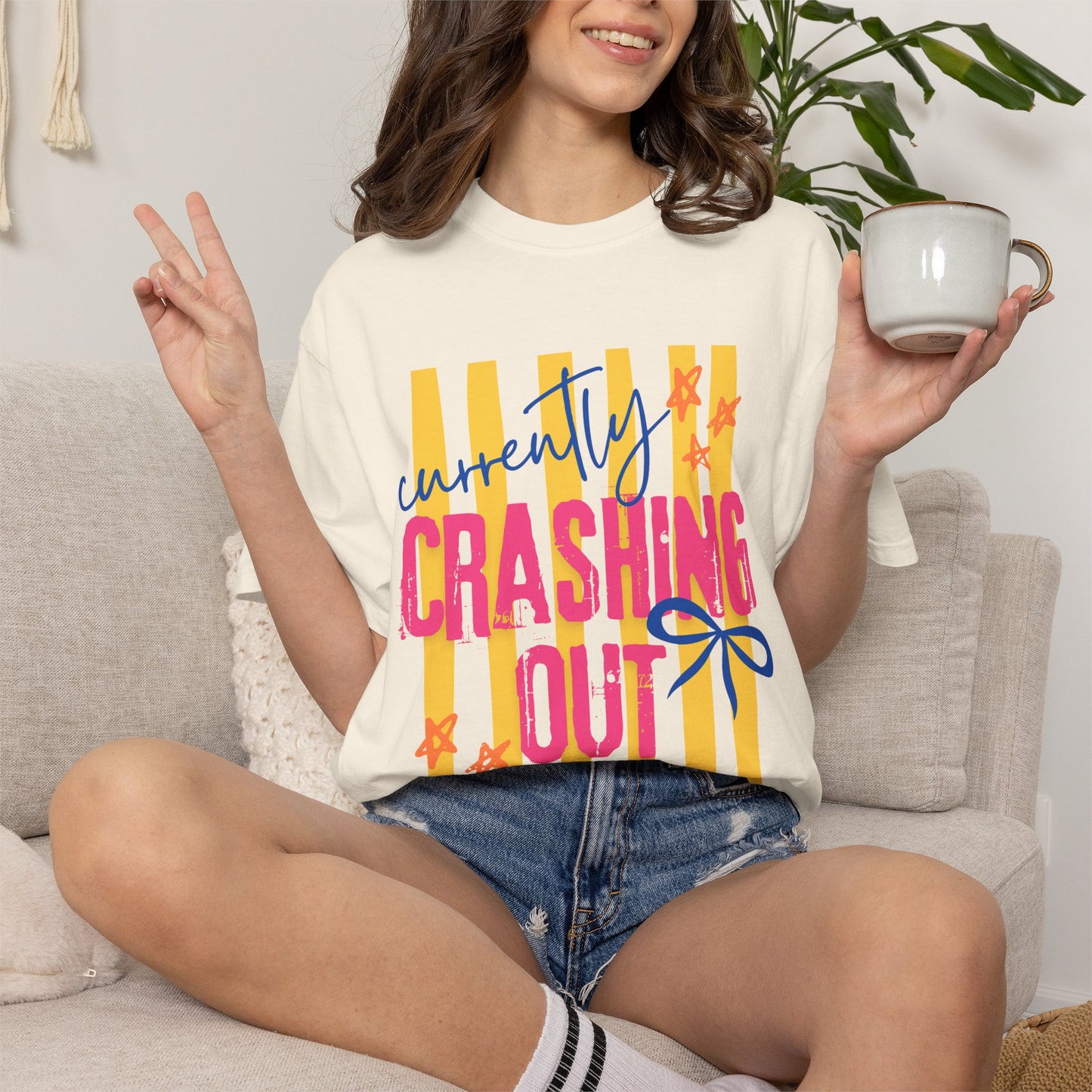 Crashing Out Graphic T‑Shirt — "Currently Crashing Out" Colorful Stripes & Bow Tee