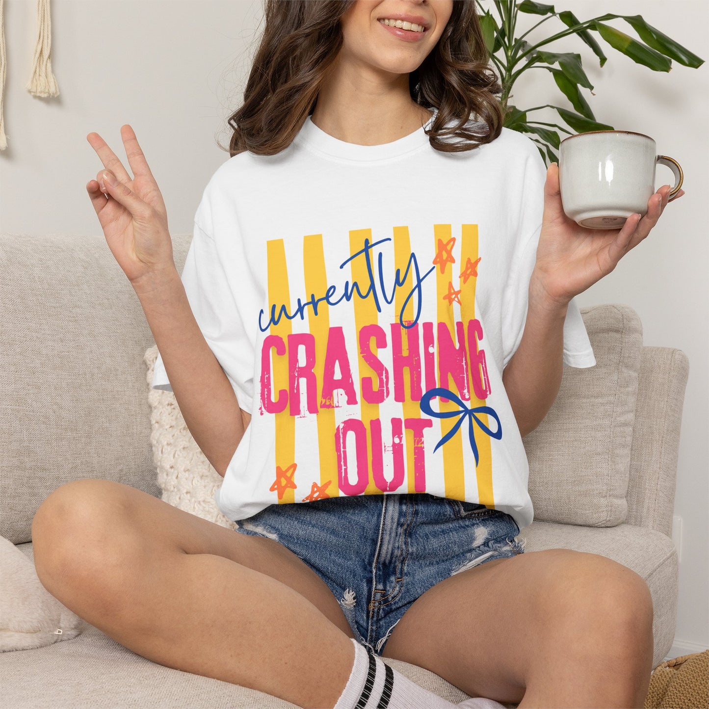 Crashing Out Graphic T‑Shirt — "Currently Crashing Out" Colorful Stripes & Bow Tee