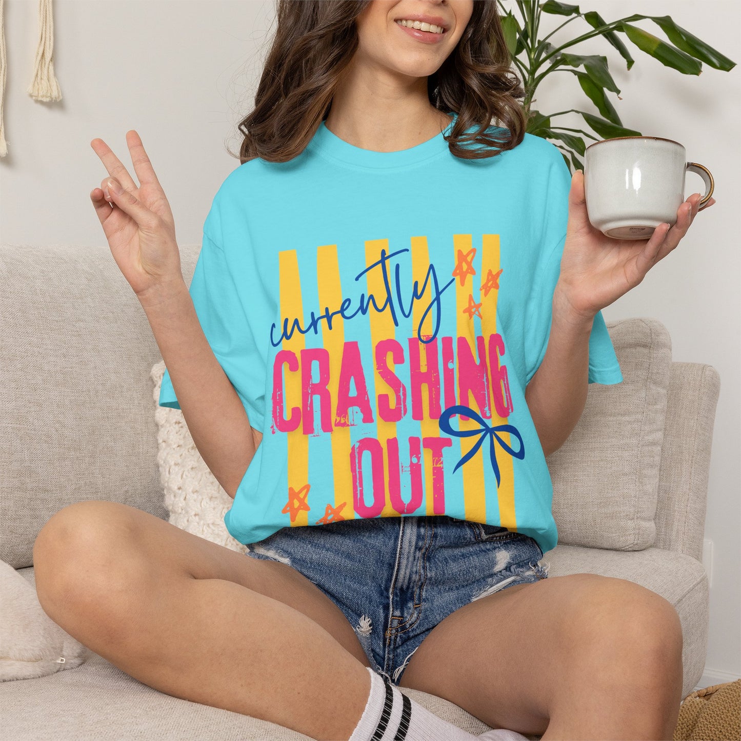 Crashing Out Graphic T‑Shirt — "Currently Crashing Out" Colorful Stripes & Bow Tee