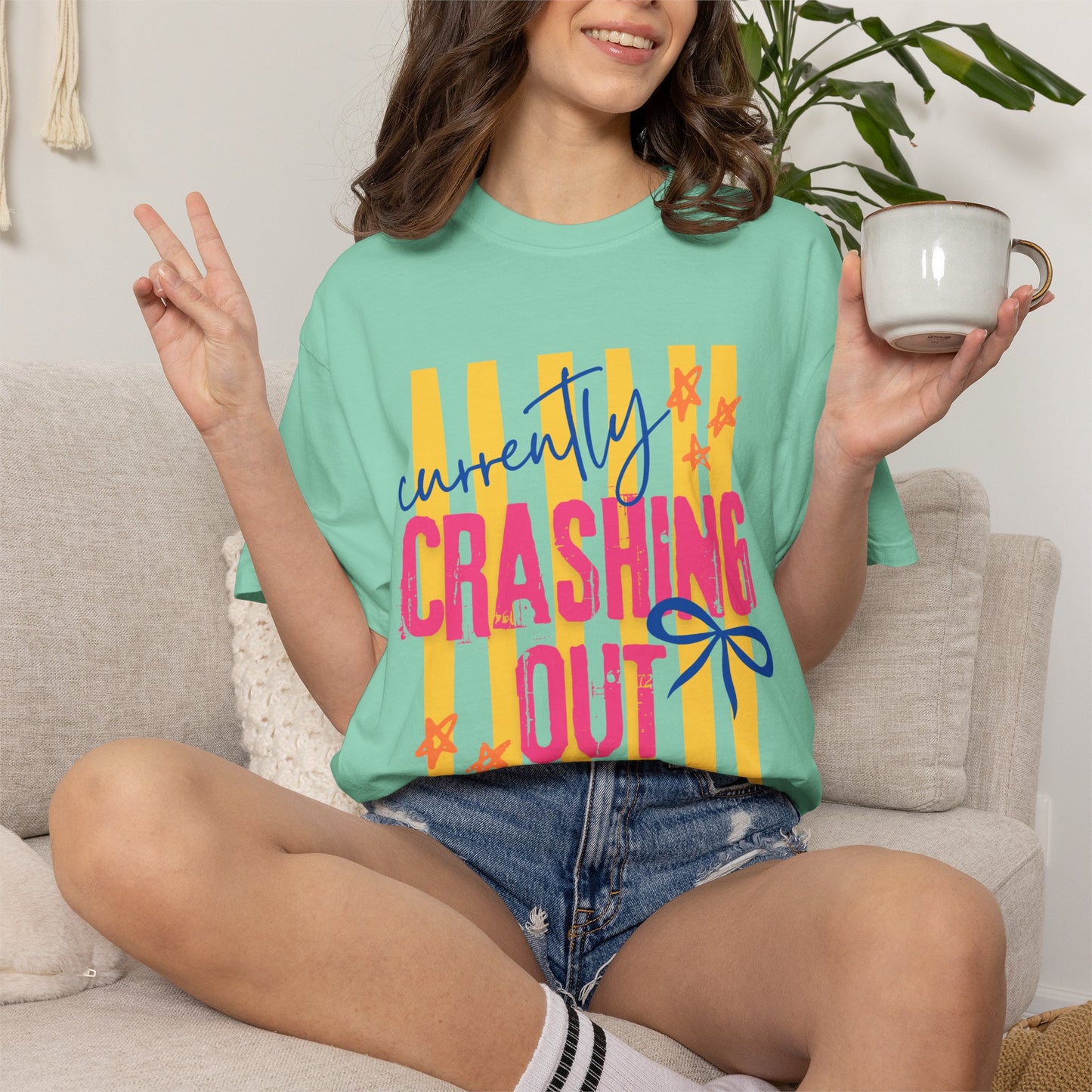 Crashing Out Graphic T‑Shirt — "Currently Crashing Out" Colorful Stripes & Bow Tee