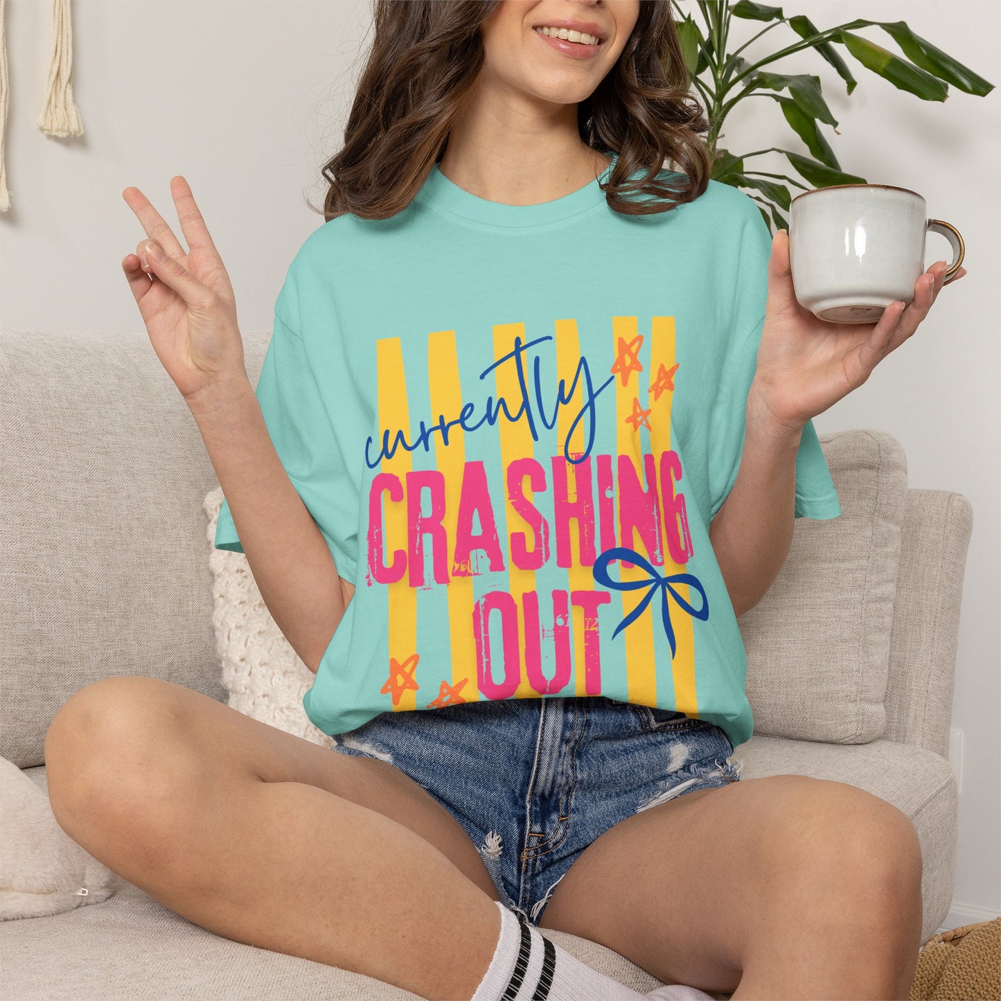 Crashing Out Graphic T‑Shirt — "Currently Crashing Out" Colorful Stripes & Bow Tee